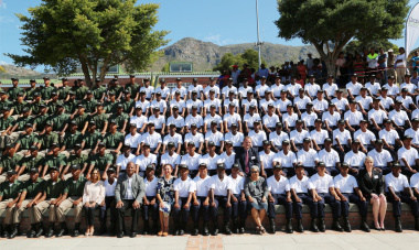 A group photograph of the 16 Charlie Graduates, with officials from the Department of Community Safety and Chrysalis Academy. 