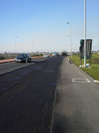 A section along the northbound carriageway of the R27 where the existing road surface has been milled out.