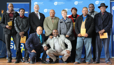 Adv. Lyndon Bouah, Wato Kobese and Anroux Marais with the representatives of the schools.