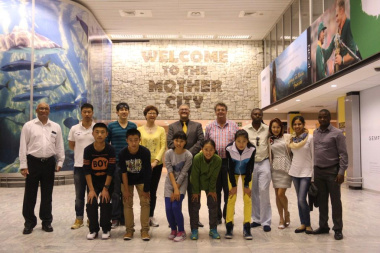 Adv Lyndon Bouah, with the youth delegation from the Qingdao Water Sports Administration Centre in Shandong, China and DCAS staff members at Cape Town International Airport