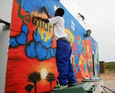 Artist pays attention to detail on the mural painting.