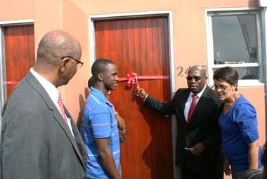 Beneficiary, Darius Mdoda receiving his new home.