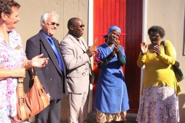 Overwhelmed Sara Gaikai as she receives her new house keys from Cllr Tjimen van Essen, Cllr Maude Goliath and Minister BMadikizela 