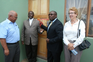 Human Settlements MEC Bonginkosi Madikizela handing over keys to beneficiary Gadilanga Alson Bonisile