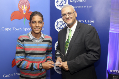 Beurick Kayser receives the Junior Sportsman of the Year award from Dr Bouah