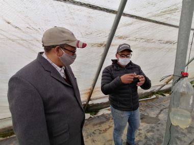 Byron Booysen showing minister Ivan Meyer his innovative pest control system
