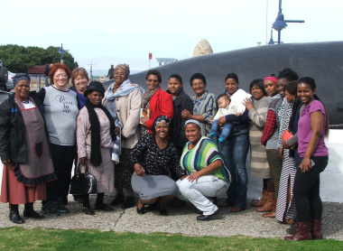 Caregivers from Lombardi Service Centre in Mount Pleasant and the Siyazama Service Centre in Zwelihle with Museum Staff