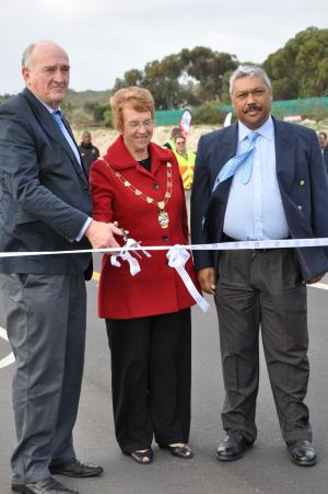 Minister Carlisle, Ms Rosil Jager, the Mayor of the Saldanha Bay Municipality, and Mr Harold Cleophas, the Mayor of the West Coast District Municipality, cut the ribbon across the MR 559. 