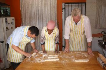  Ministers Ivan Meyer and Alan Winde participate in one of Faldela Tolker's cooking lessons.