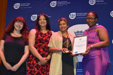 Representatives from Cape Town Central Library accepting an award for Best Public Library: Children’s Services from Nomaza Dingayo