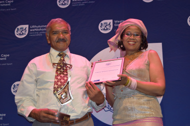 Aubrey William Springveldt receiving his award from Nikiwe Momoti for his Contribution to Marketing Archival Services and Resources 
