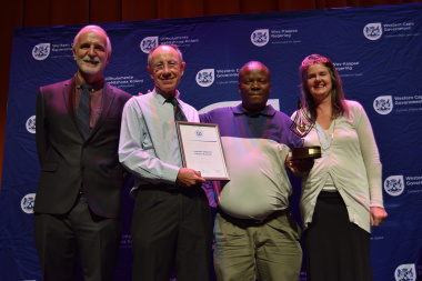 Andrew Hall with representatives from Lwandle Migrant Labour Museum receiving an award for Best Museum in 2014/2015