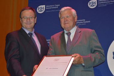 Dr Ton Vosloo receiving a ministerial award from Minister Anoton Bredell