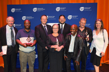 Minister Anton Bredell and HOD Walters with some of the winners of the night