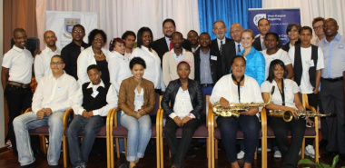 DCAS and UWC representatives with students participating in the Music Development Programme.