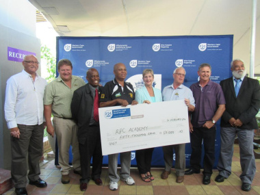 DCAS Minister, Anroux Marais, and other DCAS officials at the RPC Academy Cheque Handover
