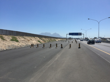 Delineators keep traffic off areas under construction.