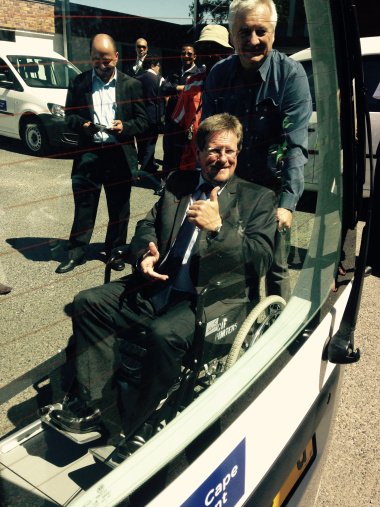 The Western Cape Minister of Health, Theuns Botha, testing the new wheelchair patient transporter that has been added to the HealthNet fleet.