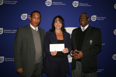 Dr Ivan Meyer, Ms Lizelle Erasmus (SWD Netball) and Mr Goliath Munro (SWD Sport Council) at the cheque handover ceremony.