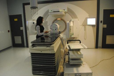 Radiograpger, Ms Jill Meaker demonstrates how the new linac machine works 