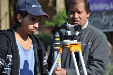 Ebrahim Isaacs and his father Ammaar capture data in the field.