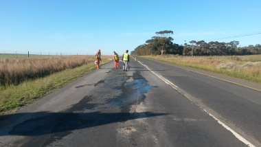 Engineers marking out areas of the existing road to be repaired.