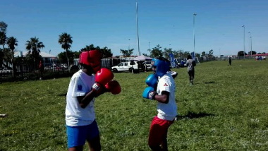 Enthusiastic learners participate in boxing