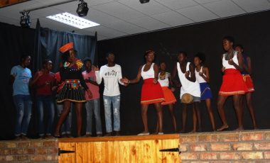 Fezekile Secondary School learners dancing on stage