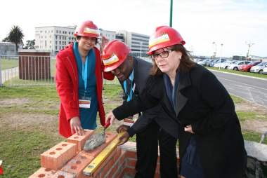 Dr Anita Parbhoo (Medical Manager), Dr Matodzi Mukosi (CEO) and Sandra Roodt (Nursing Manager) lay bricks at the symbolic brick-laying event.