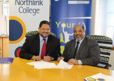 HOD of DCAS, Brent Walters, with CEO of Northlink College, Leon Beech signing the agreement.