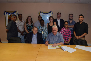 HOD Pieter van Zyl and Dr Errol Myburg with their staff at the signing of the Operational Agreement