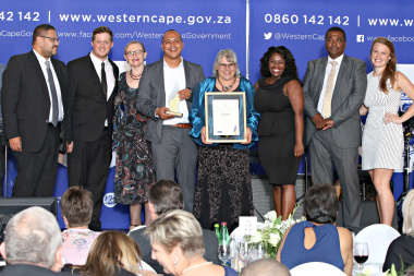 HOD Brent Walters and the After School Game Changer Team receive the gold award from Premier Zille