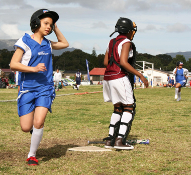 A young participant scores a home run for Cederberg Primary School.