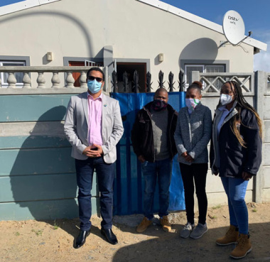 L – R: Western Cape Minister of Human Settlements, Tertuis Simmers, Mr Peter Pienaar, Mrs Jenine Pienaar and Co-Owner and Director at Nokhanya Services, Ms Faith Mabena