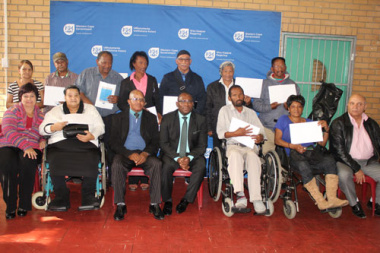 Minister Bonginkosi Madikizela and the senior beneficiaries aged over 60 who received their title deeds