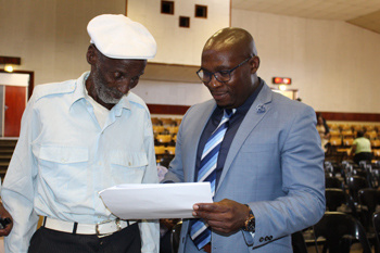 Minister Madikizela with 107-year-old, Mr Seleku James Xontana who received his title deed on Friday