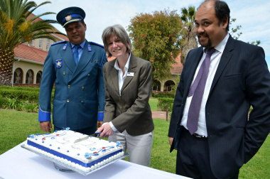 Head of Department of Transport and Public Works, Jacqui Gooch cuts the 25th Anniversary cake as Farrel Payne (Head of College) and Kyle Reinecke (Head of Branch: Transport Management) look on.