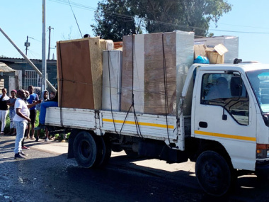 Truck transporting a beneficiary’s furniture from Kanana to Forest Village