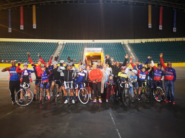 Minister Anroux Marais with the Kinetic Cycling Club