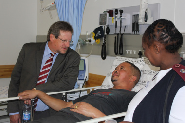 Minister Theuns Botha with patient Gashwin Spies and sister Florence Lupuwana in the emergency centre.