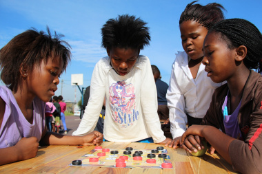 Learners at Mosheshe Primary School enjoy playing Marabaraba board games.
