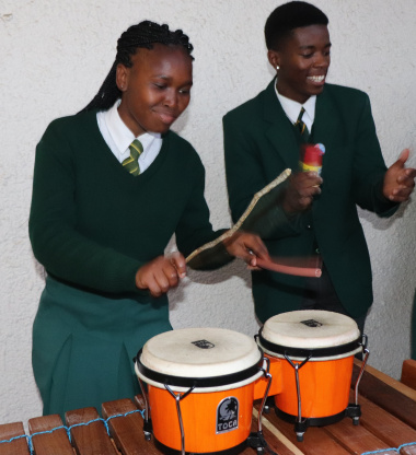 Learners from Langa High School use a spice container, pipe and stick to support the viby marimbas on the veranda of the Cape Medical Museum
