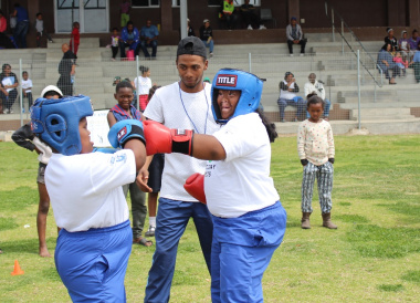 Learners participate in a boxing demonstration