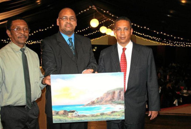 Local artist Anthony Noble Mr Charles Standers (George Municipality) and Dr Ivan Meyer with the oil painting of the Gwaing River mouth. Photo by Christo Vermaak (George Herald)