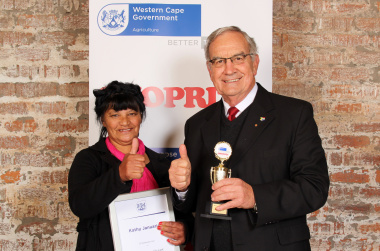 Gerrit van Rensburg, Western Cape Minister of Agriculture, with Kathy January, the Witzenberg region’s candidate for Western Cape Farm Worker of the Year 2013.