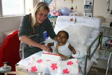 Prof. Mignon McCulloch attending to a patient at Red Cross War Memorial Children's Hospital.