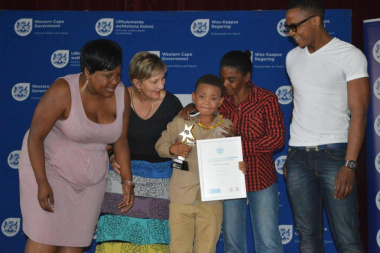 Minister Anroux Marais congratulates young Aiden who won the award for Best Supporting Actor