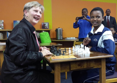 Minister Anroux Marais making use of the chess tables with national chess champion Sinoxolo Sokoyi.