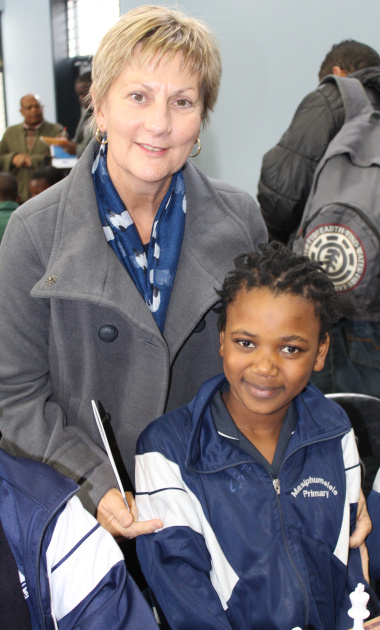 Minister Anroux Marais with Sinoxolo Sokoyi from Masiphumelele Primary School, the winner of chess in her category at the 2014 Top Schools Competition.