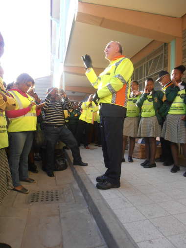 Minister Carlisle addresses pupils at Dr Nelson Mandela High School.